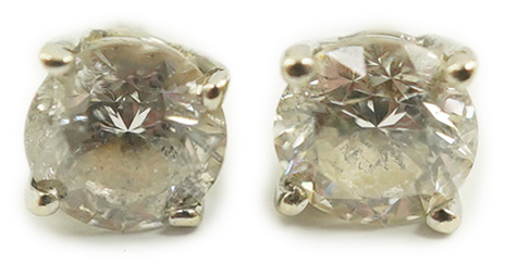 A pair of 14k white gold and solitaire diamond set ear studs